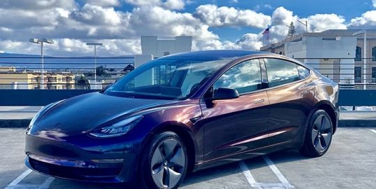 Tesla wrapped in 3M Gloss Flip Deep Space shade shifting vinyl