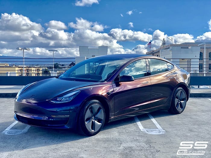 Tesla wrapped in 3M Gloss Flip Deep Space shade shifting vinyl