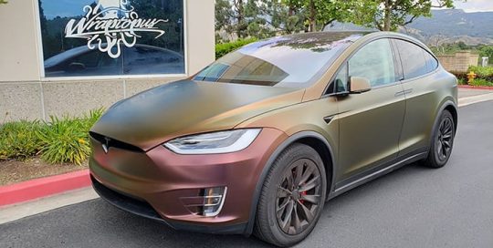 Tesla X wrapped in 3M Satin Flip Volcanic Flare shade shifting vinyl