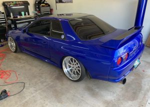 Nissan Skyline wrapped in Gloss Berry Blue vinyl