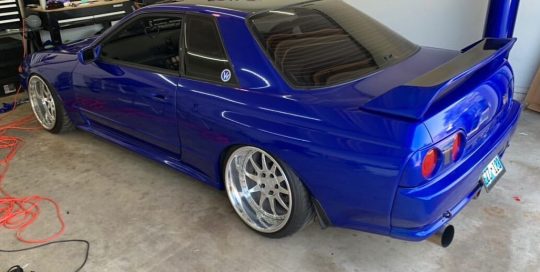Nissan Skyline wrapped in Gloss Berry Blue vinyl