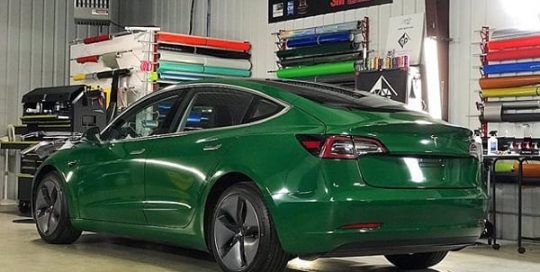 Tesla Model 3 wrapped in Avery Gloss Dark Green vinyl