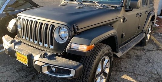 Jeep Rubicon wrapped in Matte Black vinyl