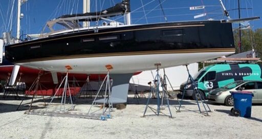 Boat wrapped in Gloss Black Metallic vinyl
