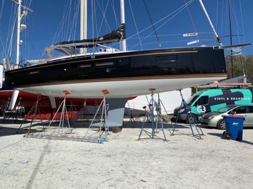 Boat wrapped in Gloss Black Metallic vinyl