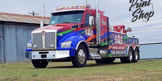 Tow Truck Commercial wrapped in custom printed Avery 1105ezrs & 1360z Gloss laminate vinyls