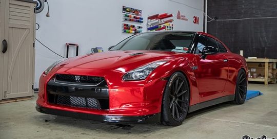 Nissan GTR wrapped in Avery Red Chrome vinyl