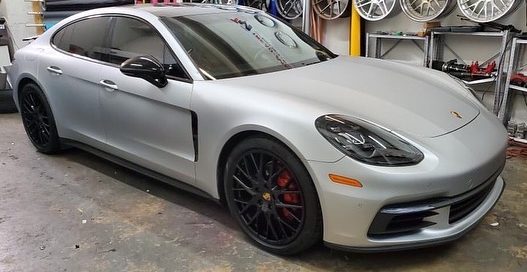 Porsche Panamera wrapped in Satin Silver Aluminum vinyl