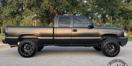 Chevrolet Silverado wrapped in 3M 1080 Satin Gold Dust Black and Matte Deep Black vinyl