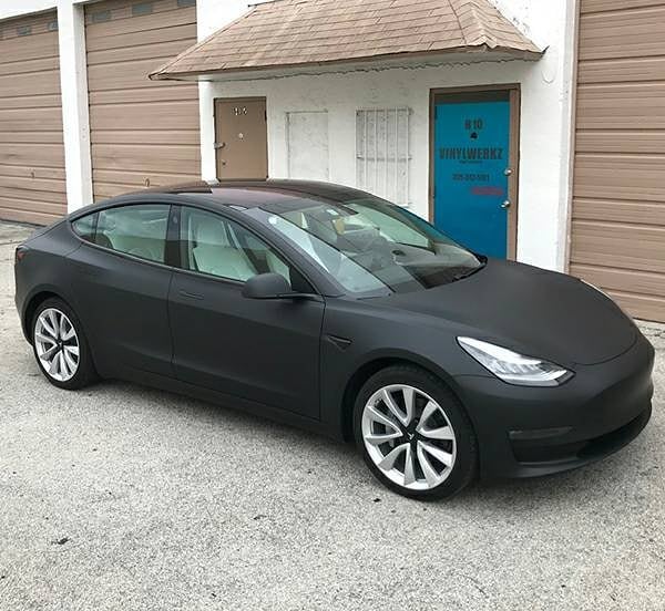 Tesla Model 3 wrapped in 3M 1080 Matte Deep Black vinyl