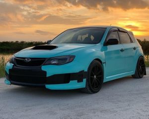 Subaru wrapped in Gloss Mint Blue vinyl
