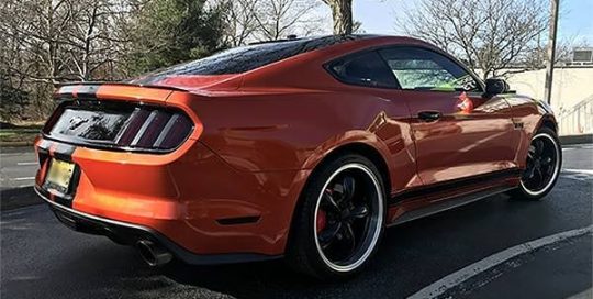 Ford Mustang wrapped in 3M 1080 Gloss Fiery Orange vinyl