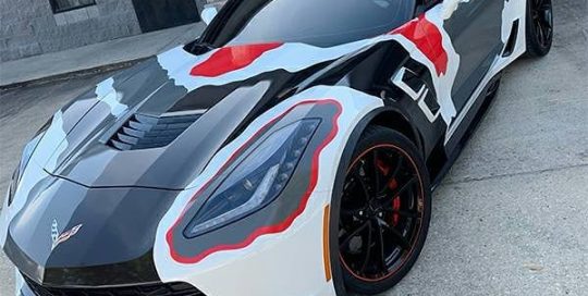 Chevrolet Corvette wrapped in 3M 1080 Gloss Hot Rod Red and Avery SW Gloss Dark Grey and Gloss Black vinyls