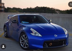 Nissan 370z wrapped in Gloss Berry Blue vinyl