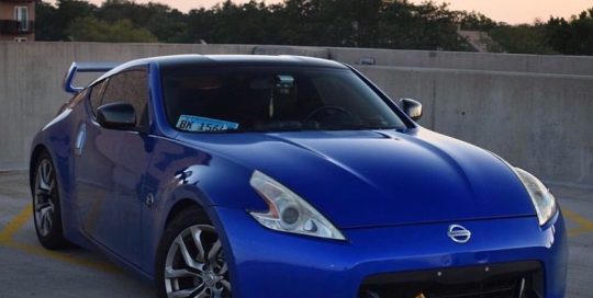 Nissan 370z wrapped in Gloss Berry Blue vinyl