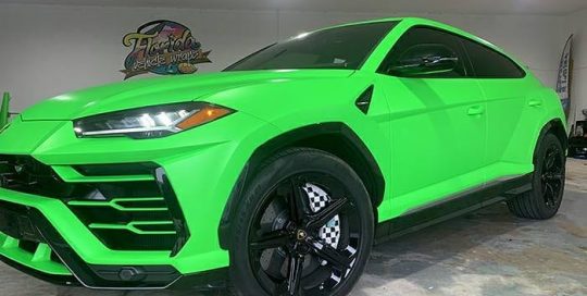 Lamborghini Urus wrapped in 3M Satin Neon Fluorescent Green vinyl