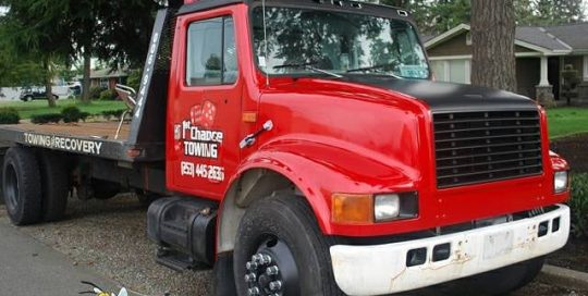 Tow Truck wrapped in using 3M Gloss Dragon Fire Red, Deep Matte Black, and 680CR Reflective vinyls