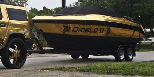 Boat wrapped in Avery Gold Chrome