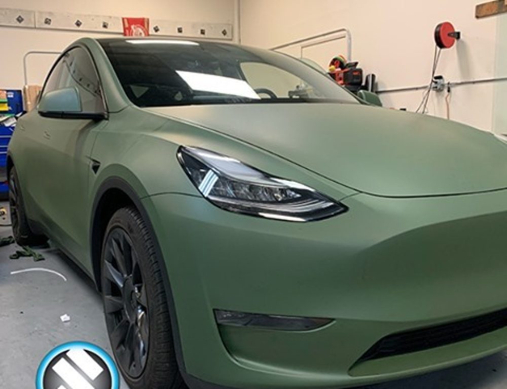 Tesla Wrapped in Avery Dennison Satin Khaki Green Vinyl Vinyl Wrap